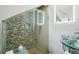Modern bathroom with a glass-enclosed shower and unique vessel sink at 14910 Northwood Village Ln, Tampa, FL 33613