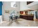 Open concept view of the dining room showcasing the kitchen and a round table with seating for six at 14910 Northwood Village Ln, Tampa, FL 33613