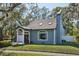 Charming home featuring an attached garage and mature landscaping at 14910 Northwood Village Ln, Tampa, FL 33613
