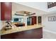 Kitchen features granite countertops, rich wood cabinetry, and breakfast bar at 14910 Northwood Village Ln, Tampa, FL 33613