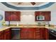 Gourmet kitchen with granite countertops, stainless steel appliances, and tile backsplash at 14910 Northwood Village Ln, Tampa, FL 33613