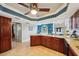 Open kitchen featuring granite countertops, dark cabinetry, and stainless steel appliances at 14910 Northwood Village Ln, Tampa, FL 33613