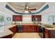 A kitchen featuring granite countertops, stainless steel appliances, and wood cabinetry at 14910 Northwood Village Ln, Tampa, FL 33613