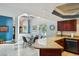 Kitchen boasts granite countertops, stainless steel appliances, and a breakfast nook with seating at 14910 Northwood Village Ln, Tampa, FL 33613