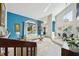 Bright, spacious living room featuring an adjacent dining area, with modern decor and large windows at 14910 Northwood Village Ln, Tampa, FL 33613