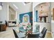 Open concept living area with a dining area, fireplace and lots of natural light from the large window at 14910 Northwood Village Ln, Tampa, FL 33613