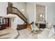 Bright, spacious living room featuring a fireplace and staircase at 14910 Northwood Village Ln, Tampa, FL 33613