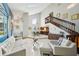 Bright, spacious living room featuring a staircase and an adjacent kitchen at 14910 Northwood Village Ln, Tampa, FL 33613