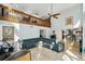 Bright living room features high ceilings, travertine floors and a large sectional sofa at 14910 Northwood Village Ln, Tampa, FL 33613