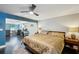 A bedroom showing a bed and a workspace with a blue accent wall in the background at 14910 Northwood Village Ln, Tampa, FL 33613