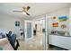 Another view of the bright and airy office with tile floors and a ceiling fan at 14910 Northwood Village Ln, Tampa, FL 33613