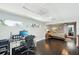 A home office with built-in shelves and a work area that connects to the primary bedroom at 14910 Northwood Village Ln, Tampa, FL 33613