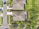 Aerial view of a home with well-maintained landscaping, screened in lanai and paver driveway at 1503 Yale Castle Ct, Ruskin, FL 33570