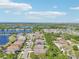 An aerial view showcases the community's lakefront properties with scenic views and lush landscaping at 1503 Yale Castle Ct, Ruskin, FL 33570