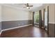 Comfortable bedroom featuring hardwood floors, natural light, and neutral color scheme, offering a serene retreat at 1503 Yale Castle Ct, Ruskin, FL 33570