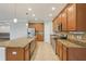 Spacious kitchen with stainless steel appliances, granite countertops, and ample cabinet space with eat-in kitchen at 1503 Yale Castle Ct, Ruskin, FL 33570