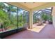 Spacious screened lanai with an outdoor dining area, ideal for entertaining guests at 1503 Yale Castle Ct, Ruskin, FL 33570