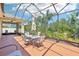Beautiful outdoor space with comfortable seating and a view of the lush greenery at 1503 Yale Castle Ct, Ruskin, FL 33570