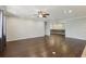 Spacious living room with hardwood floors, ceiling fan, and neutral paint, offering a bright and airy atmosphere at 1503 Yale Castle Ct, Ruskin, FL 33570
