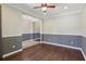 Bright room with hardwood floors, natural light from windows, and a neutral color palette, ready to be customized at 1503 Yale Castle Ct, Ruskin, FL 33570