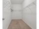 Spacious walk-in closet with wire shelving for optimal storage and organization at 1503 Yale Castle Ct, Ruskin, FL 33570