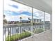 Screened-in balcony with a view of the canal and waterfront homes. Great for relaxing and enjoying the scenery at 1623 Sea Haven Dr # 307, Punta Gorda, FL 33950