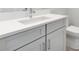 Modern bathroom vanity with white countertops, gray cabinets, and stainless steel fixtures at 1623 Sea Haven Dr # 307, Punta Gorda, FL 33950