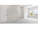 Bright bedroom with carpeted floors, white trim, and two windows providing ample natural light at 1623 Sea Haven Dr # 307, Punta Gorda, FL 33950