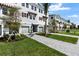 Exterior shot showcasing modern townhomes, manicured lawns, and paved walkways for a welcoming neighborhood feel at 1623 Sea Haven Dr # 307, Punta Gorda, FL 33950