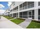 Exterior view of the modern townhomes with screened patios and well-manicured landscaping at 1623 Sea Haven Dr # 307, Punta Gorda, FL 33950