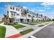 Row of new townhomes with neat landscaping, private garages, and a sidewalk for a walkable community at 1623 Sea Haven Dr # 307, Punta Gorda, FL 33950
