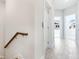 Bright hallway features wood-look tile floors and white walls leading to several rooms with natural light at 1623 Sea Haven Dr # 307, Punta Gorda, FL 33950