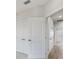 Bright hallway with multiple doors and tile flooring at 1623 Sea Haven Dr # 307, Punta Gorda, FL 33950