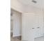 Bright hallway with multiple doors and tile flooring at 1623 Sea Haven Dr # 307, Punta Gorda, FL 33950