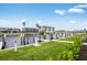 Beautiful waterfront view showing the canal, docks, and several waterfront homes on a sunny day at 1623 Sea Haven Dr # 307, Punta Gorda, FL 33950