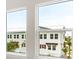 Bright view from the window with neighboring houses and palm trees at 1623 Sea Haven Dr # 307, Punta Gorda, FL 33950