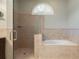Bathroom features large tub and glass enclosed shower at 17807 Crystal Cove Pl, Lutz, FL 33548