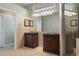 Primary bathroom features double vanities, and walk-in shower at 17807 Crystal Cove Pl, Lutz, FL 33548