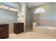 Primary bathroom features double vanities, bathtub, and glass shower at 17807 Crystal Cove Pl, Lutz, FL 33548