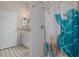 Clean bathroom features patterned floors, a shower, and a single sink vanity at 17807 Crystal Cove Pl, Lutz, FL 33548