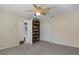 Neutral bedroom with carpeting, large closet, and a built-in bookcase at 17807 Crystal Cove Pl, Lutz, FL 33548