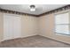 Neutral bedroom with carpet and double door closet at 17807 Crystal Cove Pl, Lutz, FL 33548