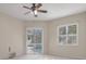 Bedroom with carpet, ceiling fan, and natural lighting at 17807 Crystal Cove Pl, Lutz, FL 33548
