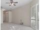 Carpeted bedroom with ceiling fan and natural lighting at 17807 Crystal Cove Pl, Lutz, FL 33548
