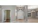 Inviting foyer with high ceilings, decorative lighting, and tile flooring offers an elegant entrance at 17807 Crystal Cove Pl, Lutz, FL 33548
