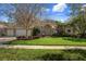 Charming one-story home with brick accents, a three-car garage, and lovely curb appeal at 17807 Crystal Cove Pl, Lutz, FL 33548