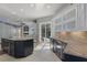 Spacious kitchen with granite counters, stainless appliances, and sliding doors leading to a pool area at 17807 Crystal Cove Pl, Lutz, FL 33548