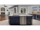 Open concept kitchen featuring stainless steel appliances, granite countertops, and modern cabinetry at 17807 Crystal Cove Pl, Lutz, FL 33548