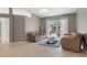 Comfortable living room with tile floors, sliding glass doors, and neutral paint for a bright feel at 17807 Crystal Cove Pl, Lutz, FL 33548