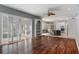 Open-concept living space connects the kitchen and living room with hardwood floors and natural light at 17807 Crystal Cove Pl, Lutz, FL 33548